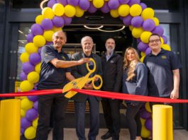 Jet Restalrig reopens following six-month transformation A group of people open Jet Restalrig in Edinburgh using a pair of novelty scissors to cut a ribbon.
