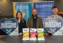 Nudie Snacks crisps range hits Scotmid shelves Lauren Rafferty, commercial development coordinator at Scotmid, Rodney Graham, managing director at Nudie Snacks and Steve Addison, local sourcing manager at Scotmid, all stand at a table for the Scottish Favourites competition with packs of Nudie Snacks sweet potato crisps.