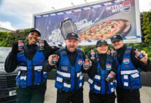Pepsi Max launches multi-channel campaign A group of people stand in front of a billboard featuring the 2026 Pepsi Max campaign whilst holding cans of Pepsi Max.