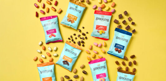 Stockley’s rolls out new Treat Bag format Bags of Stockleys sweets with sweets pouring out from them against a yellow background.