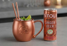 Stoli relaunches Ginger Beer cans A can of Stoli Ginger Beer stands next to a copper mug with the Stoli logo on it.