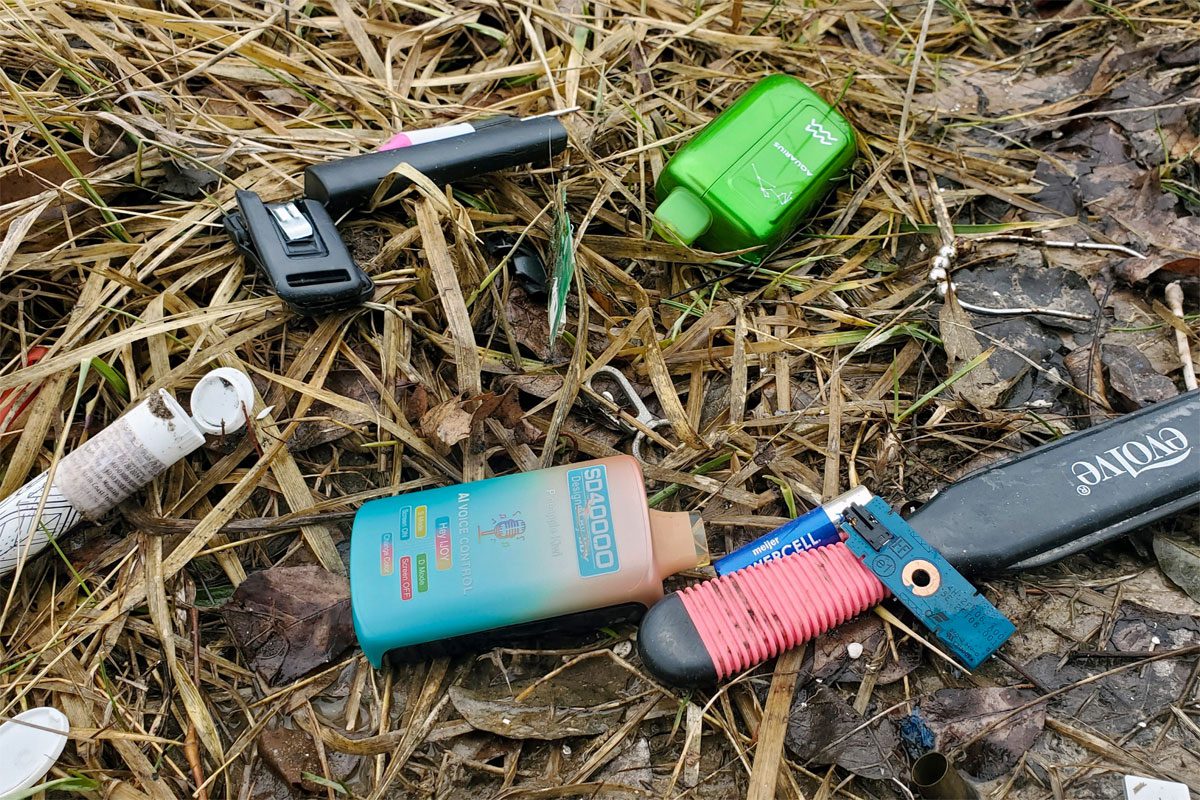 Reuseable vape devices are among a pile of litter that has been left.