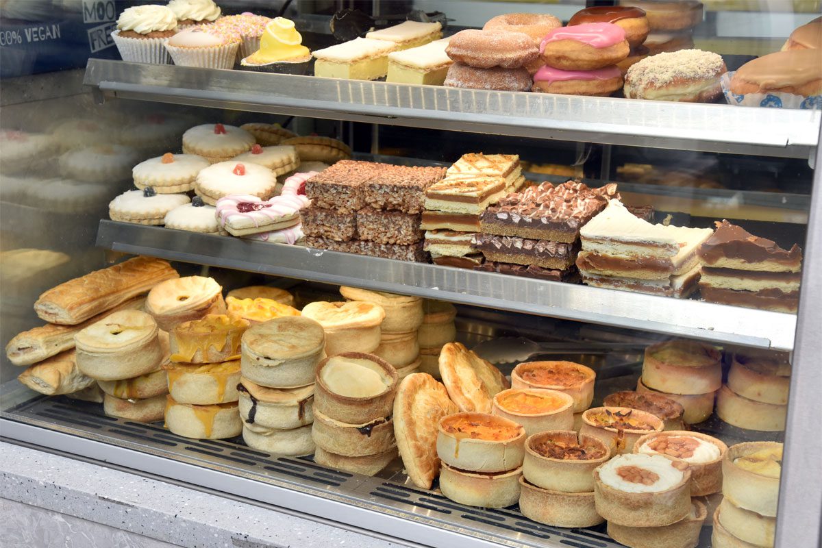 Bakery cabinet with cakes and pastries.