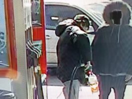 Fuel theft crime wave magnified by first-time offenders Two people stand at a forecourt fuel station as one of them fills up a plastic bottle with fuel to steal.