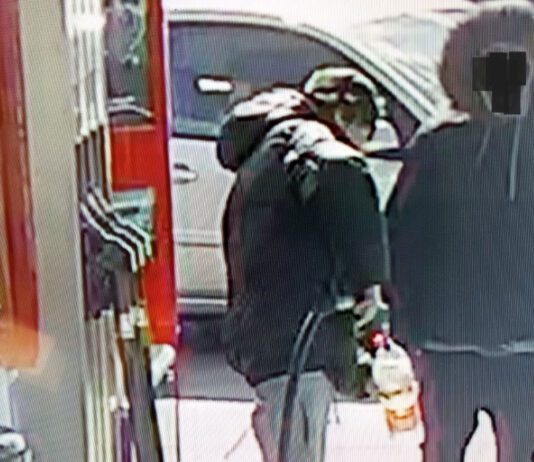 Fuel theft crime wave magnified by first-time offenders Two people stand at a forecourt fuel station as one of them fills up a plastic bottle with fuel to steal.
