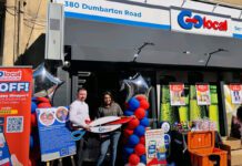 Glasgow’s first Go Local store opens its doors Two people stand outside Go Local Dumbarton Road holding a pair of novelty scissors at the store's door to mark the opening of the location.