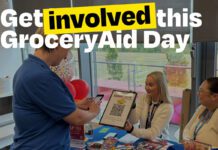 Rallying support for GroceryAid Day 2026 A person attends a Haribo stand to scan a QR code with the slogan 'Get involved this GroceryAid Day'.