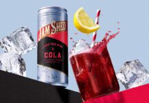 Jam Shed blends red wine and cola in a can Promotional image for the launch of Jam Shed Jammy Red Wine & Cola cans with a can of the drink next to a glass with the drink inside.