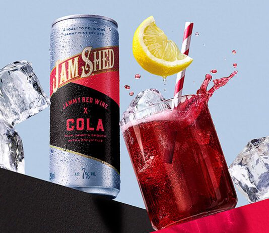Jam Shed blends red wine and cola in a can Promotional image for the launch of Jam Shed Jammy Red Wine & Cola cans with a can of the drink next to a glass with the drink inside.
