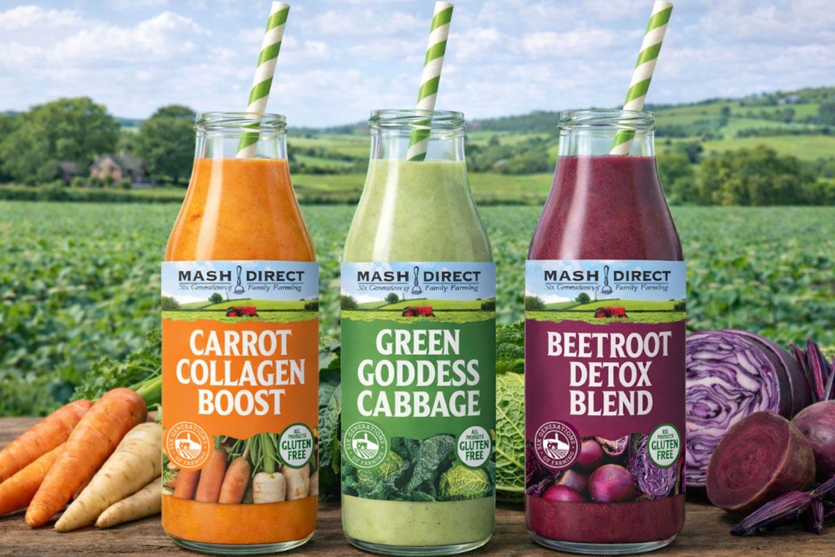 Bottles of Mash Direct drinks stand against a farming background.