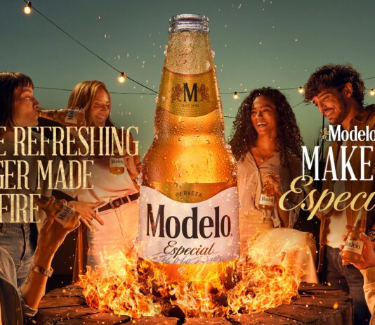 Modelo Especial launches across the UK Promotional image of the UK launch for Modelo Especial with people gathered round a campfire with a bottle of the beer rising out of the flames.