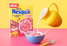 Nesquik introduces new Strawberry flavour A box of Nesquik Strawberry cereal stands behind a bowl with the cereal inside and a yellow jug which pours milk into the bowl.