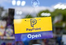 PayPoint invites retailers to take part in annual survey A door has a PayPoint open sign hanging on it.