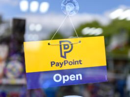 PayPoint invites retailers to take part in annual survey A door has a PayPoint open sign hanging on it.
