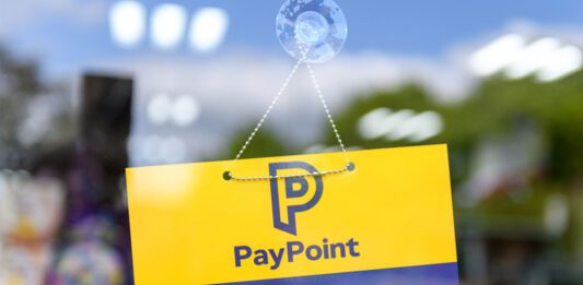 PayPoint invites retailers to take part in annual survey A door has a PayPoint open sign hanging on it.