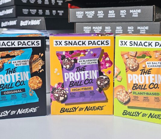 The Protein Ball Co rolls out new multipacks Packs of The Protein Ball Co Snack Packs stand upright on a table in Peanut Butter, Blueberry Oat Muffin and Salted Caramel flavours.