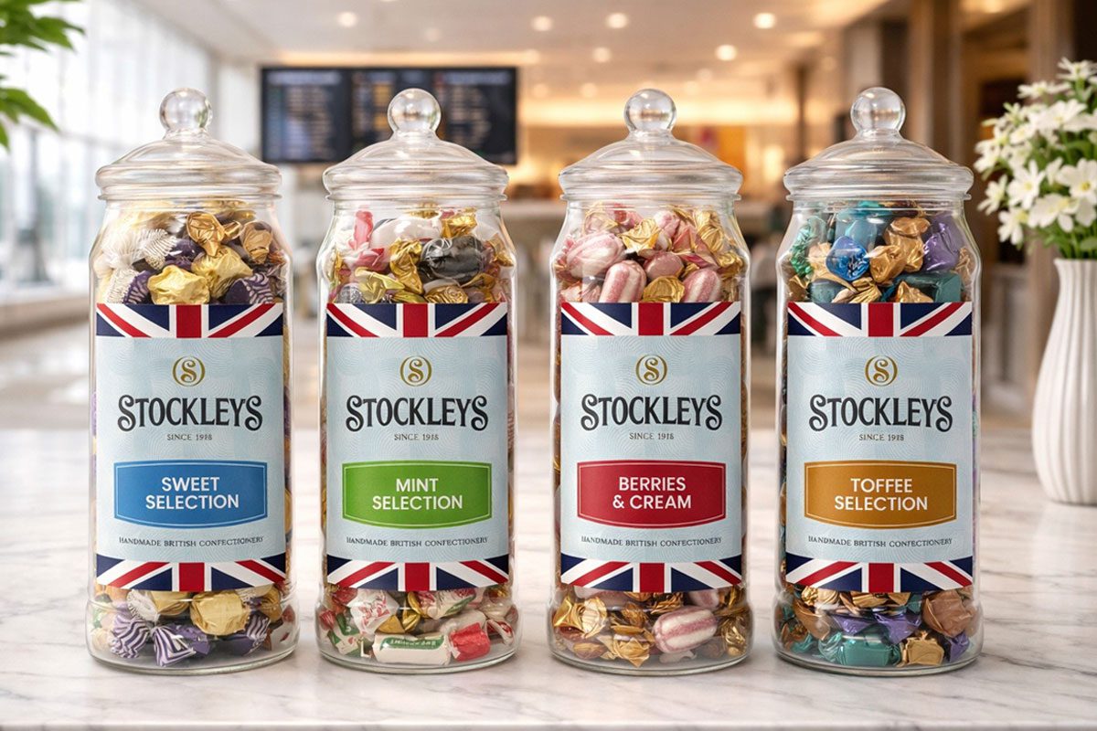 Stockleys Heritage Jars stand in a line against a tourist-themed background.
