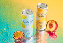 West Coast Coolers land across Scottish shelves Cans of West Coast Cooler Original and West Coast Cooler Sunburst stand on a watery surface with a passionfruit and peach standing next to them.