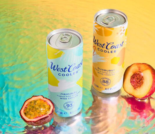 West Coast Coolers land across Scottish shelves Cans of West Coast Cooler Original and West Coast Cooler Sunburst stand on a watery surface with a passionfruit and peach standing next to them.