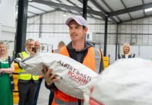 Andy Murray marks 20million meal milestone at Albert Bartlett Andy Murray stands holding a sack of potatoes with the Albert Bartlett logo on the bag.