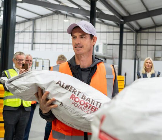 Andy Murray marks 20million meal milestone at Albert Bartlett Andy Murray stands holding a sack of potatoes with the Albert Bartlett logo on the bag.