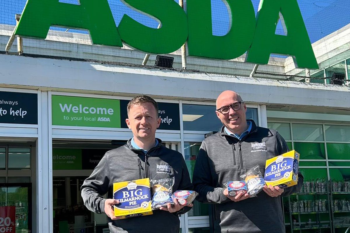 Staff members from Brownings the Bakers stand outside an Asda store holding Brownings products.