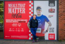 CCEP supports Special Olympics with Meals that Matter Angus Leckonby, Special Olympics GB Athlete, stands in front of the CCEP Meals that Matter promotional image which features him.