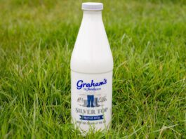 Graham’s fuels traditional dairy demand with Silver Top milk A bottle of Graham's Silver Top milk stands in a grassy field.