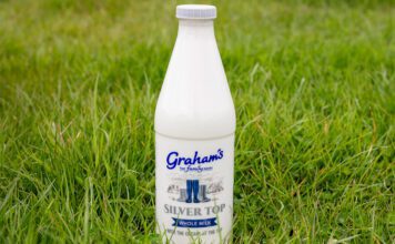 Graham’s fuels traditional dairy demand with Silver Top milk A bottle of Graham's Silver Top milk stands in a grassy field.
