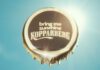 Kopparberg launches ‘Bring me Sunshine’ campaign for summer A bottle cap with the words 'bring me sunshine Kopparberg' stamped on it against a sunny sky background.