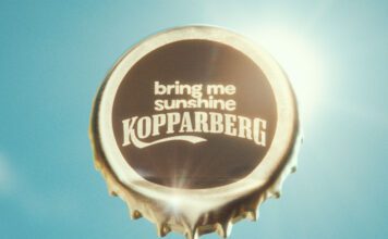 Kopparberg launches ‘Bring me Sunshine’ campaign for summer A bottle cap with the words 'bring me sunshine Kopparberg' stamped on it against a sunny sky background.
