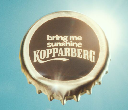 Kopparberg launches ‘Bring me Sunshine’ campaign for summer A bottle cap with the words 'bring me sunshine Kopparberg' stamped on it against a sunny sky background.