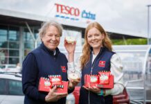 McGhee’s Empire Biscuit joins Tesco meal deal range Gordon McGhee and Aisling McGhee stand outside a Tesco supermarket store holding empire biscuits.