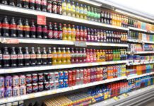 ONS inflation eases as energy prices fall A refrigerator unit inside a retail store with soft drinks in it.