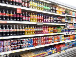 ONS inflation eases as energy prices fall A refrigerator unit inside a retail store with soft drinks in it.