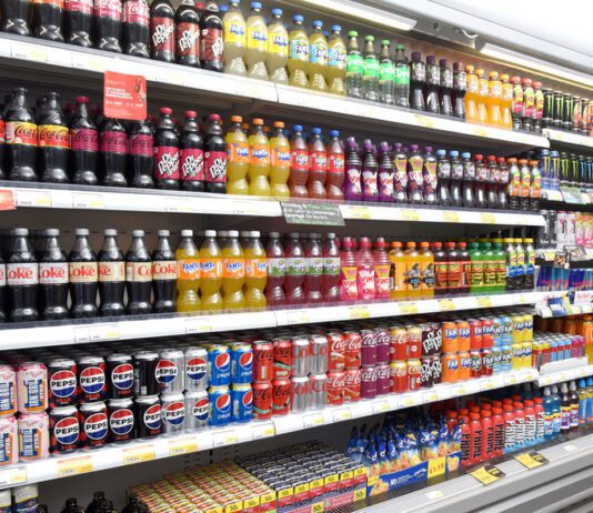 ONS inflation eases as energy prices fall A refrigerator unit inside a retail store with soft drinks in it.