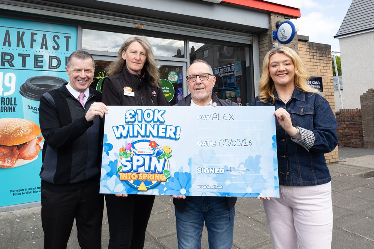 Representatives from Spar Scotland stand with the winner of the £10k grand prize of Spin into Spring outside Spar Whitletts.