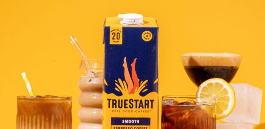 TrueStart launches Espresso Coffee Concentrate A carton of TrueStart Espresso Coffee Concentrate stands in the middle of multiple different serves using the coffee against a yellow background.