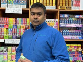 The Fed calls on ScotGov to put retailers at the heart of agenda Uthayakumar Soundararajan, Scottish president at The Federation of Independent Retailers, stands inside a store with licensed products behind him.