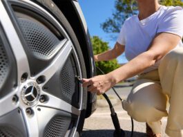 Air-serv sees increase in tyre inflation checks across UK A woman inflates her tyre at a forecourt station.