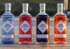 Ben Lomond Gin unveils new bottle design Bottles of the Ben Lomond Gin redesign for 2026 are lined up on a wooden pier.