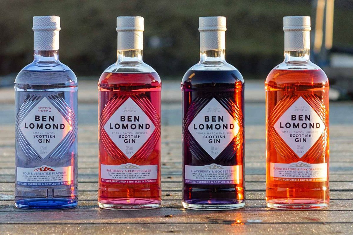 Bottles of the Ben Lomond Gin redesign for 2026 are lined up on a wooden pier.