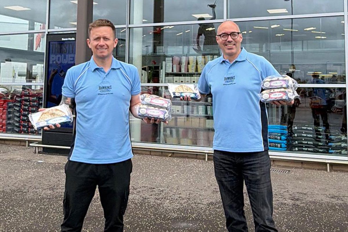 Fraser Gall, sales director at Brownings the Bakers, and Declan McMahon, managing director at Brownings the Bakers, stand outside a Sainsbury's store holding Brownings products.