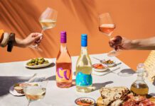 Campo Viejo introduces lighter Contemporary wine range A table dinner is set with different foods and bottles of Campo Viejo Contemporary Rosa and Blanco variants.