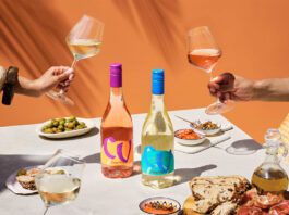 Campo Viejo introduces lighter Contemporary wine range A table dinner is set with different foods and bottles of Campo Viejo Contemporary Rosa and Blanco variants.