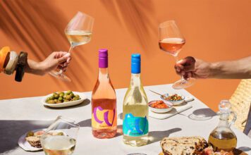Campo Viejo introduces lighter Contemporary wine range A table dinner is set with different foods and bottles of Campo Viejo Contemporary Rosa and Blanco variants.