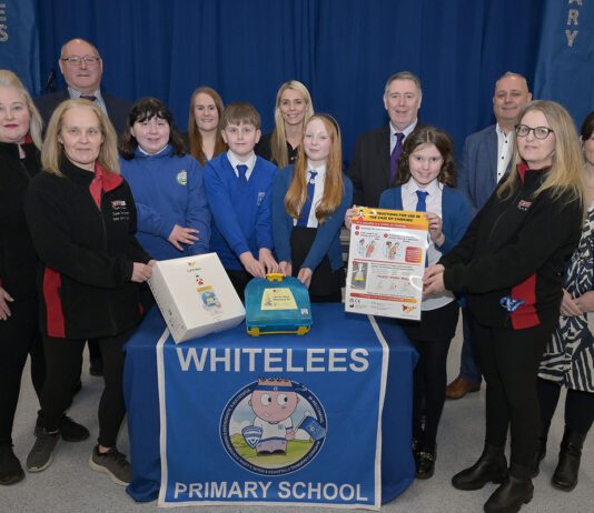 Spar Condorrat hits major LifeVac milestone Staff members from Spar Condorrat stands with primary school pupils from Whitelees along with staff members at the school.