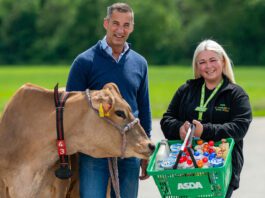 Graham’s Dairy lands new listings in Asda stores Robert Graham, managing director at Graham's The Family Dairy, stands next to Keira McTaggart, community champion at Asda Alloa, stand together as Robert has a cow next to him and Keira holds an Asda basket.