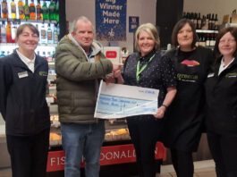 Greens of Fraserburgh donates £1,000 to local community A group of people stand in Greens of Fraserburgh to present a cheque to a local charity group.