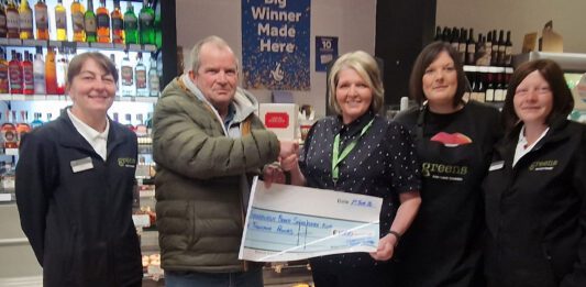 Greens of Fraserburgh donates £1,000 to local community A group of people stand in Greens of Fraserburgh to present a cheque to a local charity group.